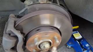 Change the Front Brakes On a Volvo V40 [upl. by Ydassac]